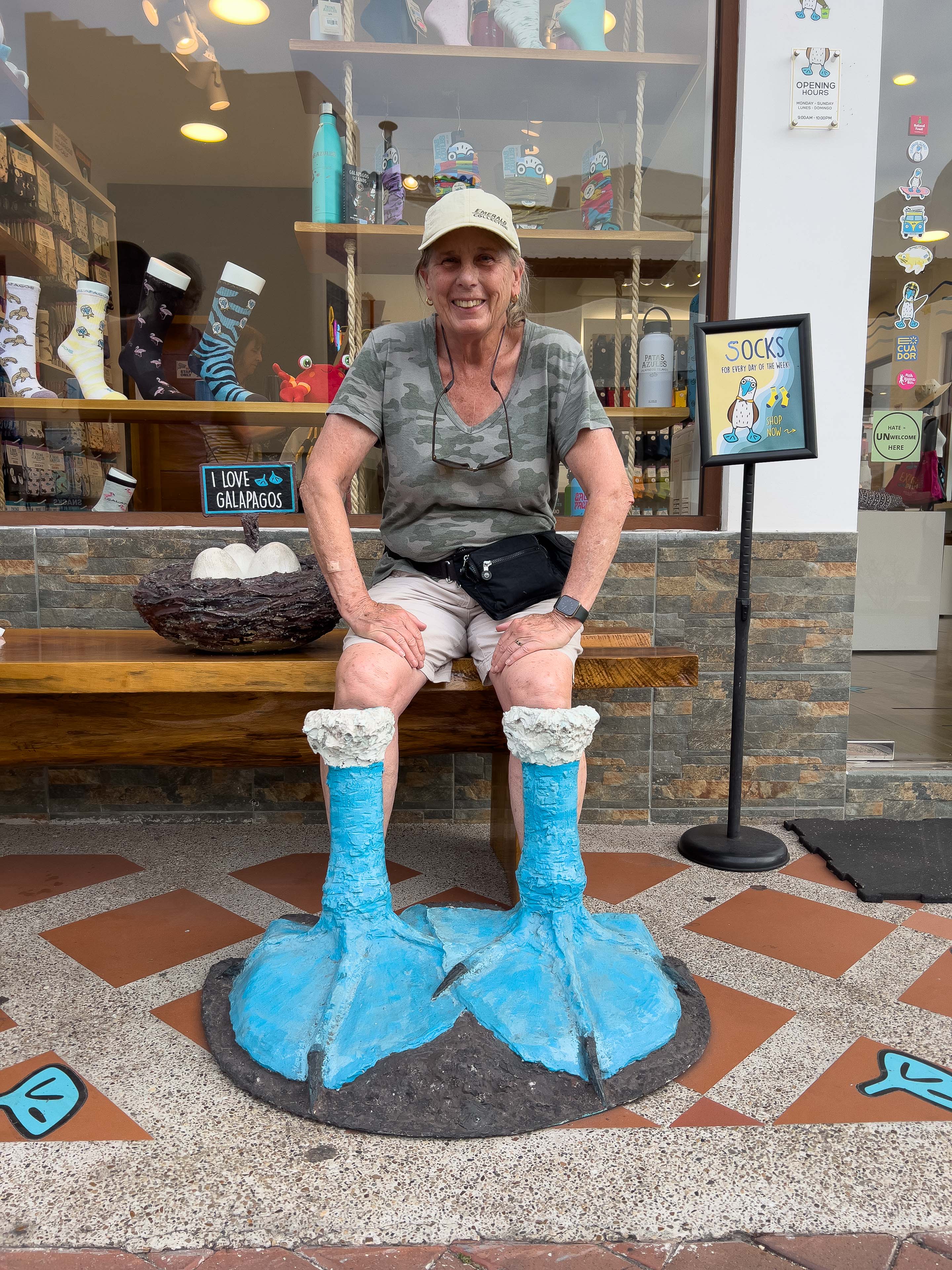 a woman in a wet suit standing on a beach